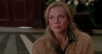 Movie still from “The War of the Roses” (1989), directed by Danny DeVito – A person wearing a jacket; Close Up shot, Over the shoulder angle