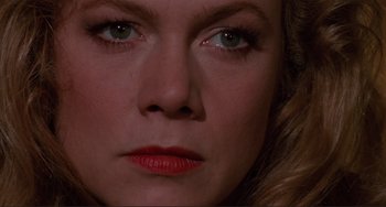 Movie still from “The War of the Roses” (1989), directed by Danny DeVito – A woman's face with blue eyes; Extreme Close Up shot, High angle