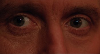 Movie still from “The War of the Roses” (1989), directed by Danny DeVito – View of a person's eyes; Extreme Close Up shot, Overhead angle