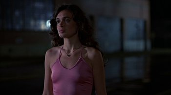 Movie still from “The Warriors” (1979), directed by Walter Hill – A beautiful young lady wearing a pink top; Close Up shot, Low angle