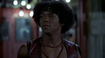 Movie still from “The Warriors” (1979), directed by Walter Hill – A person wearing a leather vest; Close Up shot, Low angle