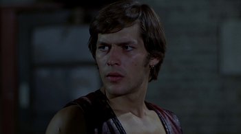Movie still from “The Warriors” (1979), directed by Walter Hill – A person wearing a vest; Close Up shot, Low angle
