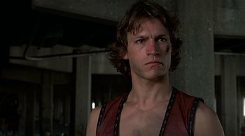 Movie still from “The Warriors” (1979), directed by Walter Hill – A person wearing a shirt; Close Up shot, Low angle