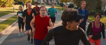 Movie still from “The Watch” (2012), directed by Akiva Schaffer – A group of people running down a street; Medium shot, Over the shoulder angle