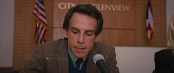 Movie still from “The Watch” (2012), directed by Akiva Schaffer – Ben stiller sitting at a microphone; Close Up shot, Over the shoulder angle