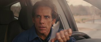 Movie still from “The Watch” (2012), directed by Akiva Schaffer – Ben stiller in a car holding a knife; Close Up shot, Over the shoulder angle