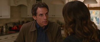 Movie still from “The Watch” (2012), directed by Akiva Schaffer – Ben stiller in front of a woman in a room; Close Up shot, Over the shoulder angle