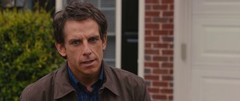 Movie still from “The Watch” (2012), directed by Akiva Schaffer – Ben stiller in front of a brick building; Close Up shot, Over the shoulder angle