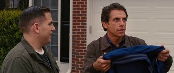 Movie still from “The Watch” (2012), directed by Akiva Schaffer – Two men standing outside of a brick building; Medium shot, Over the shoulder angle