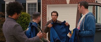 Movie still from “The Watch” (2012), directed by Akiva Schaffer – Two men standing outside of a brick building; Medium shot, Over the shoulder angle