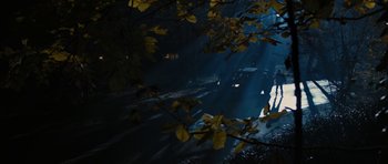 Movie still from “The Watch” (2012), directed by Akiva Schaffer – A street scene with a car driving down the road; Extreme Wide shot, High angle