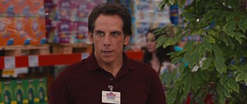 Movie still from “The Watch” (2012), directed by Akiva Schaffer – Ben stiller in a red shirt and a name tag; Medium shot, Over the shoulder angle