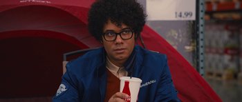 Movie still from “The Watch” (2012), directed by Akiva Schaffer – A man holding a drink in his hand; Close Up shot, Over the shoulder angle