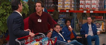 Movie still from “The Watch” (2012), directed by Akiva Schaffer – A group of people sitting in front of shopping carts; Medium shot, Over the shoulder angle
