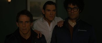 Movie still from “The Watch” (2012), directed by Akiva Schaffer – A group of men standing next to each other in a room; Medium shot, Over the shoulder angle