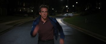 Movie still from “The Watch” (2012), directed by Akiva Schaffer – A man running down a street at night; Medium shot, High angle