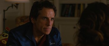 Movie still from “The Watch” (2012), directed by Akiva Schaffer – A person wearing a jacket and tie; Close Up shot, Over the shoulder angle