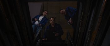Movie still from “The Watch” (2012), directed by Akiva Schaffer – A group of men standing on top of a set of stairs; Medium shot, Low angle