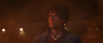 Movie still from “The Watch” (2012), directed by Akiva Schaffer – A young man with glasses looking up at the sky; Close Up shot, Low angle