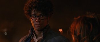 Movie still from “The Watch” (2012), directed by Akiva Schaffer – A man wearing glasses standing in a dark room; Close Up shot, Over the shoulder angle