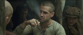 Movie still from “The Way Back” (2010), directed by Peter Weir – A person smoking a cigarette; Close Up shot, Over the shoulder angle