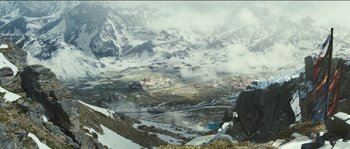 Movie still from “The Way Back” (2010), directed by Peter Weir – A view of a valley with a mountain range in the background; Extreme Wide shot, High angle
