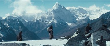 Movie still from “The Way Back” (2010), directed by Peter Weir – A man standing on top of a snow covered slope; Extreme Wide shot, Low angle