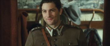 Movie still from “The Way Back” (2010), directed by Peter Weir – A person wearing a military uniform; Close Up shot, Over the shoulder angle