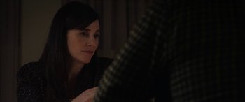 Movie still from “The Way Back” (2020), directed by Gavin O'Connor – A woman sitting in front of a mirror looking down; Close Up shot, Over the shoulder angle