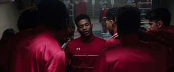 Movie still from “The Way Back” (2020), directed by Gavin O'Connor – A group of young men standing next to each other; Close Up shot, Over the shoulder angle