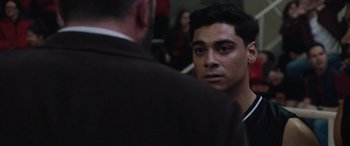 Movie still from “The Way Back” (2020), directed by Gavin O'Connor – A man in a brown jacket talking to another man in a brown jacket; Close Up shot, Over the shoulder angle