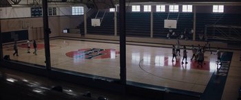 Movie still from “The Way Back” (2020), directed by Gavin O'Connor – An empty basketball court in an indoor arena; Extreme Wide shot, High angle