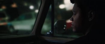 Movie still from “The Way Back” (2020), directed by Gavin O'Connor – A woman sitting in a car looking out the window; Close Up shot, Over the shoulder angle