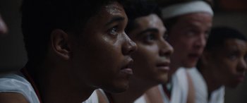 Movie still from “The Way Back” (2020), directed by Gavin O'Connor – Two young men are looking into the distance; Close Up shot, Low angle
