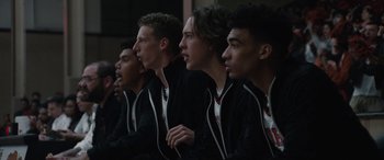 Movie still from “The Way Back” (2020), directed by Gavin O'Connor – A group of young men standing next to each other; Close Up shot, Over the shoulder angle