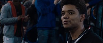 Movie still from “The Way Back” (2020), directed by Gavin O'Connor – A young man is looking into the distance; Close Up shot, Over the shoulder angle