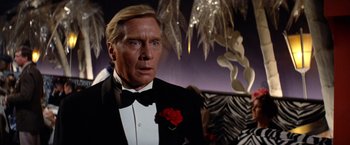 Movie still from “The Way We Were” (1973), directed by Sydney Pollack – A person wearing a suit and tie; Close Up shot, Low angle