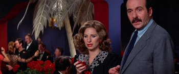 Movie still from “The Way We Were” (1973), directed by Sydney Pollack – A woman holding an object in her hand; Close Up shot, Over the shoulder angle