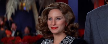 Movie still from “The Way We Were” (1973), directed by Sydney Pollack – A person wearing a wig; Close Up shot, High angle