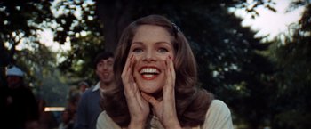 Movie still from “The Way We Were” (1973), directed by Sydney Pollack – A woman with her hands up to her face; Close Up shot, Low angle