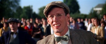 Movie still from “The Way We Were” (1973), directed by Sydney Pollack – A person wearing glasses and a bow tie; Close Up shot, Low angle