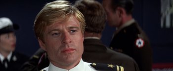 Movie still from “The Way We Were” (1973), directed by Sydney Pollack – A person wearing a uniform; Close Up shot, Low angle