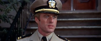 Movie still from “The Way We Were” (1973), directed by Sydney Pollack – A person wearing a uniform; Close Up shot, Low angle