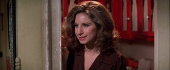 Movie still from “The Way We Were” (1973), directed by Sydney Pollack – A person with long hair; Close Up shot, Over the shoulder angle