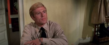 Movie still from “The Way We Were” (1973), directed by Sydney Pollack – A man with blonde hair wearing a dress shirt and a tie; Close Up shot, Low angle