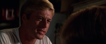 Movie still from “The Way We Were” (1973), directed by Sydney Pollack – A person with blond hair; Close Up shot, Over the shoulder angle