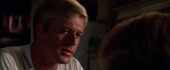 Movie still from “The Way We Were” (1973), directed by Sydney Pollack – A person with blond hair; Close Up shot, Over the shoulder angle