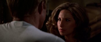 Movie still from “The Way We Were” (1973), directed by Sydney Pollack – A man and a woman looking at one another; Close Up shot, Over the shoulder angle