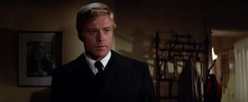 Movie still from “The Way We Were” (1973), directed by Sydney Pollack – A person wearing a suit and tie; Close Up shot, Low angle