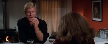 Movie still from “The Way We Were” (1973), directed by Sydney Pollack – A man and a woman sitting at a dinner table; Close Up shot, Over the shoulder angle